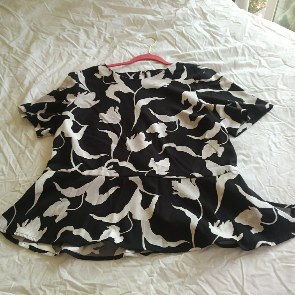 Black blouse with white flowers.